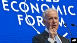 US Vice President Joe Biden gestures as he speaks at the plenary session of the World Economic Forum in Davos, Switzerland, Jan. 20, 2016.