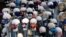 Masks placed on mannequins heads are displayed outside a shop in Sarajevo's main street, Bosnia, Monday, July 27, 2020. 