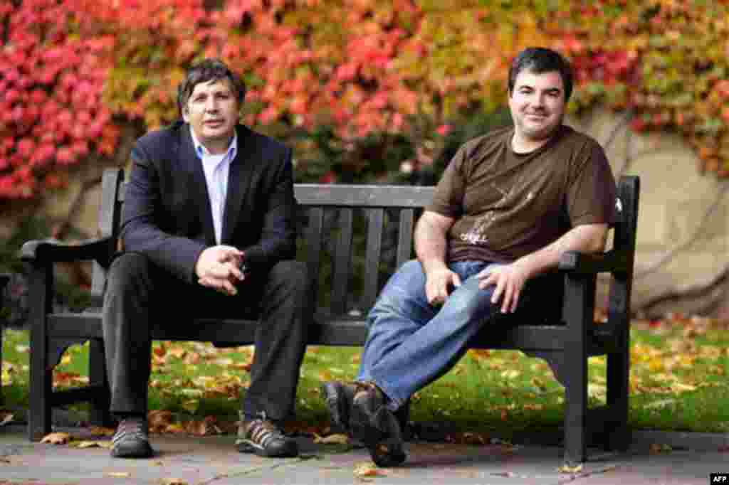 Professor Andre Geim, left, and Dr Konstantin Novoselov who have have been awarded the Nobel Prize for Physics pose for pictures outside Manchester University, Manchester, England, Tuesday, Oct, 5, 2010. The scientists shared the Nobel Prize in physics