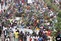 FILE - Opposition supporters demonstrate against the Independent Electoral and Boundaries Commission in Nairobi, Kenya, Oct. 11, 2017.