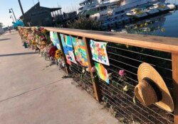A growing memorial to those who died aboard the dive boat Conception is seen early Friday morning, Sept. 6, 2019 at the harbor in Santa Barbara, Calif.