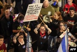 FILE— Relatives and supporters of Israeli hostages during a demonstration in front of the Defense Ministry in Tel Aviv, on April 20, 2024.