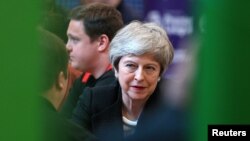 FILE - British Prime Minister Theresa May visits the Leisure Box while on a local elections campaign, in Brierfield, Lancashire, Britain, April 25, 2019. 