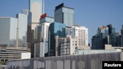 FILE - Graffiti has been removed off a fence in Hong Kong's financial district, the site of many 2019 protests, Hong Kong, China, April 23, 2021.