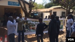 Members of Tajamuka-Sesijikile Campaign demonstrating outside the Unicef offices in Harare. (Photo: Patricia Mudadigwa)