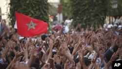 Protesters rally during a demonstration organized by the February 20 movement in Rabat, July 3, 2011.