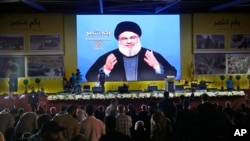 Le chef du Hezbollah, Sayyed Hassan Nasrallah, s'adresse à ses partisans lors du 12è anniversaire de la guerre de 2006 entre Israel et le Hezbollah, Beyrouth, Liban, le 14 août 2018.