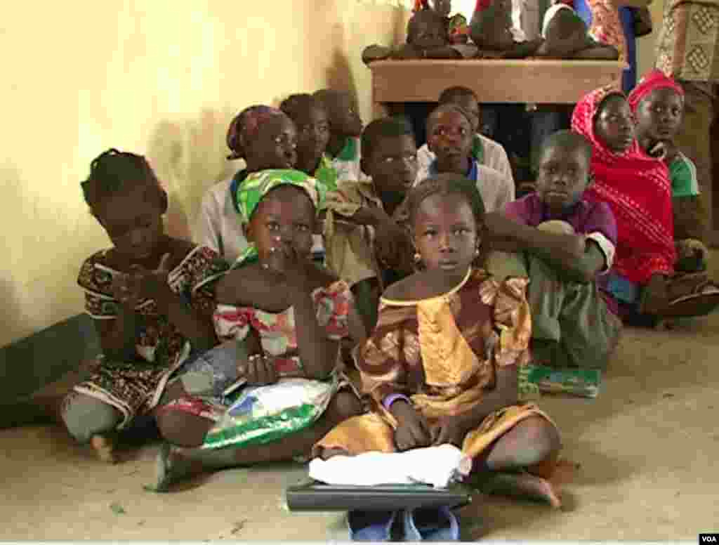 Children are seen sitting on the floor of their school in Fotokol, Cameroon. (M.E. Kinzeka/VOA)