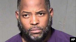 This undated law enforcement booking photo from the Maricopa County, Ariz., Sheriff's Department shows Abdul Malik Abdul Kareem. 