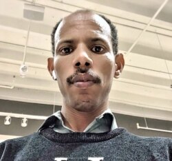 Machine operator Halefom Tesfalem says Smithfield Foods should have taken more coronavirus precautions at its plant in Sioux Falls, South Dakota. Shown here in a Skype screen grab, he is recovering from COVID-19.