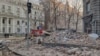 A view of debris on a street from nearby buildings, hundreds of meters from Ukraine's Presidential Office, after a Russian drone attack in Kyiv, Ukraine, Jan. 1 2025.