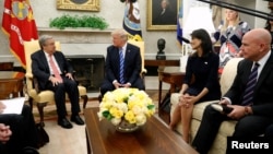 U.S. President Donald Trump, flanked by U.S. Ambassador to the United Nations Nikki Haley (2nd R) and National Security Adviser H.R. McMaster (R), delivers remarks to reporters as he welcomes United Nations Secretary General Antonio Guterres (L) for a mee