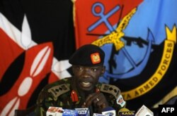 FILE - Kenya Army Colonel Cyrus Oguna speaks during a press conference in Nairobi's military headquarters, Nov. 26, 2011.
