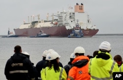 FILE - The giant LNG ship Al Nuaman, which carries 200,000 cubic meters of liquefied gas, arrives in the Baltic port of Swinoujscie, Poland, Dec. 11, 2015, after 21 days of travel from Qatar.