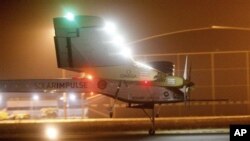 An experimental solar-powered plane, Solar Impulse, approaches to make a night landing at Rabat airport, Morocco, Tuesday, June 5, 2012 after a 20-hour trip from Madrid in the first transcontinental flight by a craft of its type. (AP Photo/Abdeljalil Boun