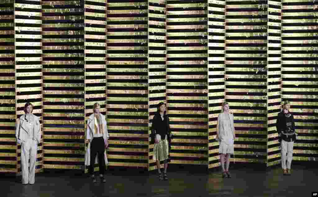 Models wear creations for Belgian fashion house Dries van Noten&#39;s ready-to-wear Spring/Summer 2014 fashion collection, presented in Paris, France.