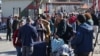 Foreign nationals arriving from Syria stand at the Lebanese Masnaa border crossing, Dec. 9, 2024. Turkey's foreign and defense ministries are coordinating evacuations of third-country nationals from Syria with logistical support of Turkish ground forces.