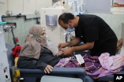 A Palestinian woman receives dialysis treatment in a hospital in Rafah, Gaza Strip, on Jan. 20, 2024.