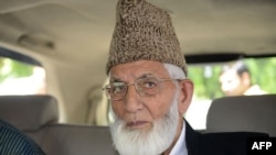 FILE - In this Aug. 19, 2014, photo Kashmiri separatist leader Syed Ali Shah Geelani arrives at the Pakistan Embassy in New Delhi.
