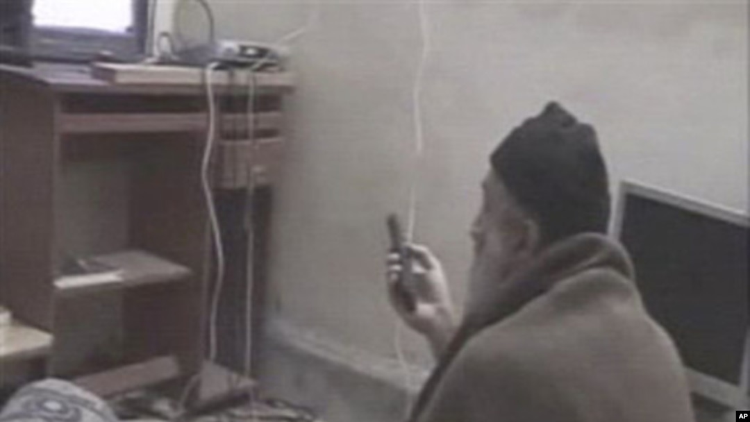 In this undated image taken from video provided by the U.S. Department of Defense, a man who the American government says is Osama bin Laden watches television in a video released on May 7, 2011