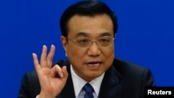 Perdana Menteri China Li Keqiang dalam jumpa pers setelah upacara penutupan Kongres Rakyat Nasional China di Beijing (13/3). (Reuters/Barry Huang)