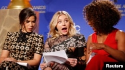 Actors America Ferrera, Chloe Grace Moretz and Angela Bassett (L-R) react as they look over notes before announcing the nominations for the 73rd annual Golden Globe Awards in Beverly Hills, California December 10, 2015. (REUTERS/Danny Moloshok)
