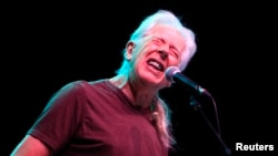 FILE - Blues legend John Mayall performs during a concert in Bucharest, Romania, Nov. 11, 2012.