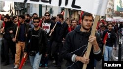 University students rally to mark the anniversary of the shooting of a 15-year-old student by a policeman in 2008 in Athens, Dec. 6, 2014. 