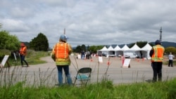 Volunteers direct traffic in Bolinas, a coastal enclave in Northern California that began testing all residents for the novel coronavirus and its antibodies on Monday, one of the first such efforts since the pandemic hit the United States three months ago