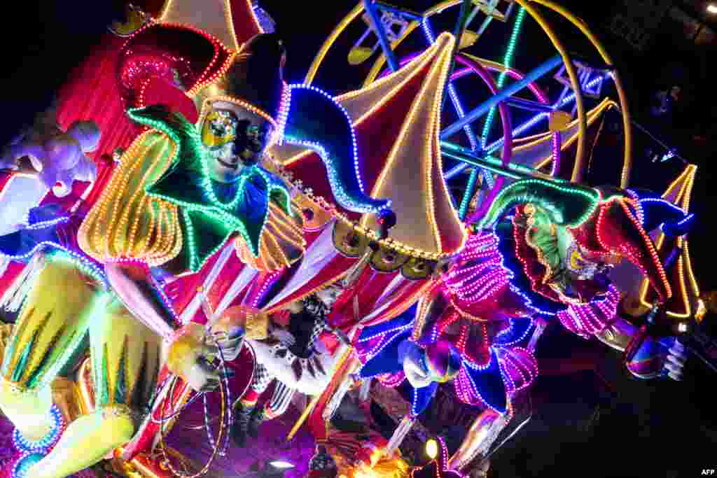 Revelers take part in the Light Festival parade in San Jose, Costa Rica, Dec. 14, 2019.