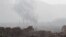 Smoke rises during a battle between forces loyal to former Yemeni President Ali Abdullah Saleh and Houthi fighters, in Sana'a, Yemen, Dec. 2, 2017. 