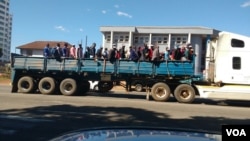 Vehicles, some of them allegedly seized from schools, ferrying Zanu PF supporters to the million man march.