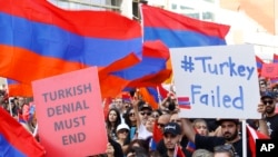 FILE - Huge crowds of Armenian Americans march during an annual commemoration of the deaths of 1.5 million Armenians under the Ottoman Empire, in Los Angeles, April 24, 2019.