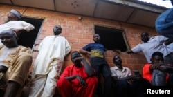 FILE - Parents attend a meeting at the Salihu Tanko Islamic school in Tegina, Niger state, Nigeria, Aug. 10, 2021. Gunmen raided the school May 30, kidnapping 136 students.