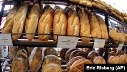 Loaves of sourdough bread are for sale are on display at Boudin at the Wharf at Fisherman's Wharf in San Francisco. (AP Photo/Eric Risberg)