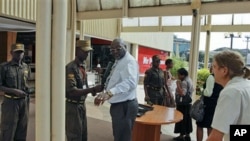 Shoppers entering the Yaya Centre shopping mall are searched by security guards in Nairobi, Kenya, January 2012. (file photo)