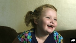 Beauty pageant regular and reality show star Alana "Honey Boo Boo" Thompson gestures during an interview in her home in McIntyre, Ga, September 10, 2012.