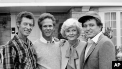 FILE - Members of the original cast of the "Leave It To Beaver," from left, Ken Osmond, Tony Dow, Barbara Billingsley and Jerry Mathers during the filming of their TV special, "Still The Beaver," in Los Angeles, Dec. 10, 1982. 