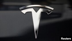 FILE - A Tesla logo is seen in Los Angeles, California US.