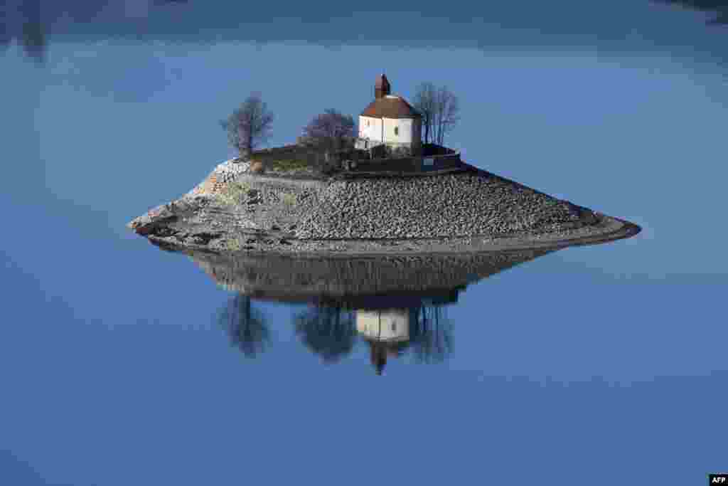 The Saint-Michel Chapel is seen on a small island in the middle of the Serre-Ponçon artificial lake in Savines-le-Lac, France, one of the largest in Europe.