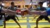 People participate in a beer yoga session, as the country eases the coronavirus disease (COVID-19) restrictions, at a craft brewery in Phnom Penh, Cambodia January 19, 2021. (REUTERS/Cindy Liu)