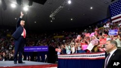 President Donald Trump waves to the crowd as he arrives to speak at a rally in Johnson City, Tenn., Oct. 1, 2018. 