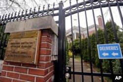 A metal fence surrounds the residence of Russia's consul general Monday, March 26, 2018, in Seattle.