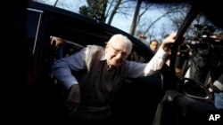 Former SS guard Oskar Groening steps out of a car as he arrives at the back entrance of the court hall prior to a trail against him in Lueneburg, northern Germany, April 21, 2015.