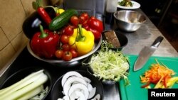 FILE - Vegetables are seen in vegetarian restaurant in Minsk, Belarus, Feb. 1, 2018. Researchers found that clever marketing using appealing descriptions of food can help boost sales of plant-based dishes. 