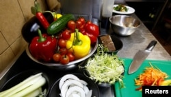 FILE - Vegetables are seen in vegetarian restaurant in Minsk, Belarus, Feb. 1, 2018. Researchers found that clever marketing using appealing descriptions of food can help boost sales of plant-based dishes. 