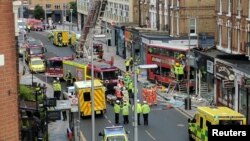 Emergency services respond to a bus crash in Lavender Hill, London, Aug. 10, 2017.