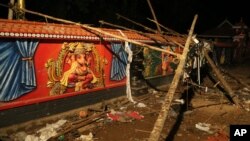 Debris lies against a wall at the Puttingal temple in Kerala state, India. About 100 died when a fire broke out at the temple during a fireworks display April 10, 2016.