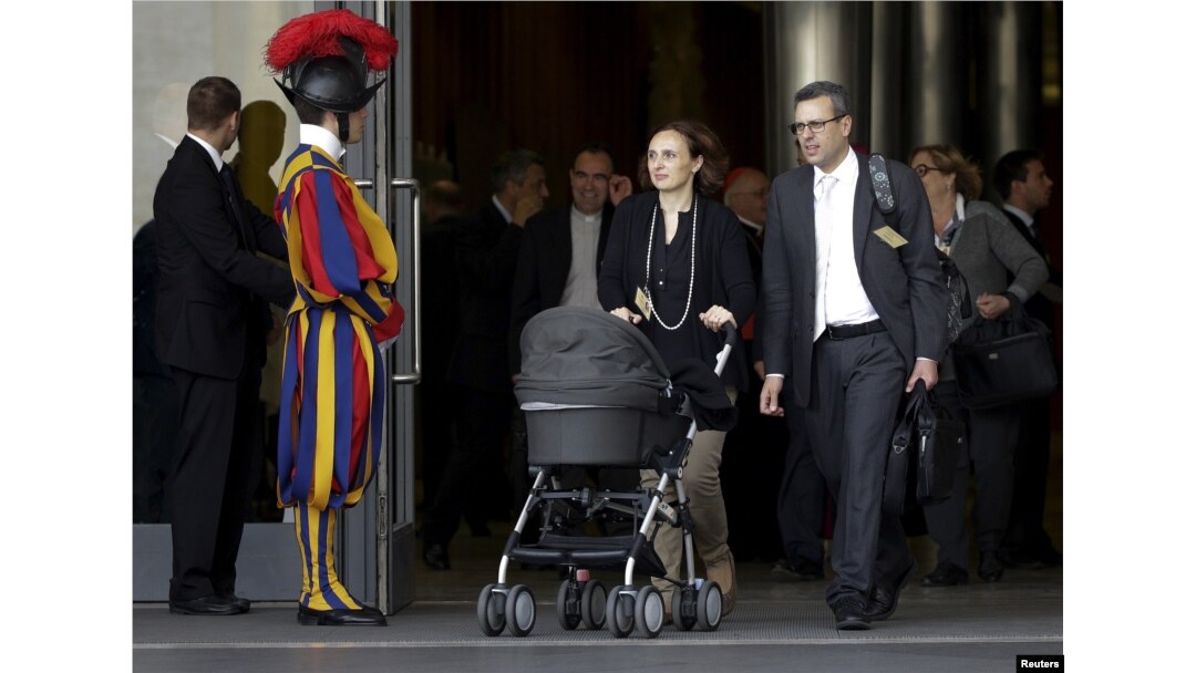 Attendees leave the synod of the family at the end of the morning session led by Pope Francis at the Vatican, Oct. 5, 2015.