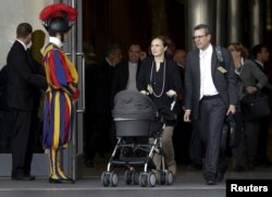 Attendees leave the synod of the family at the end of the morning session led by Pope Francis at the Vatican, Oct. 5, 2015.